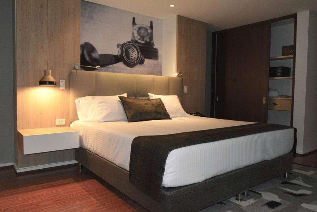 Quo Quality Hotel Manizales Oda fotoğraf A bedroom at the hotel