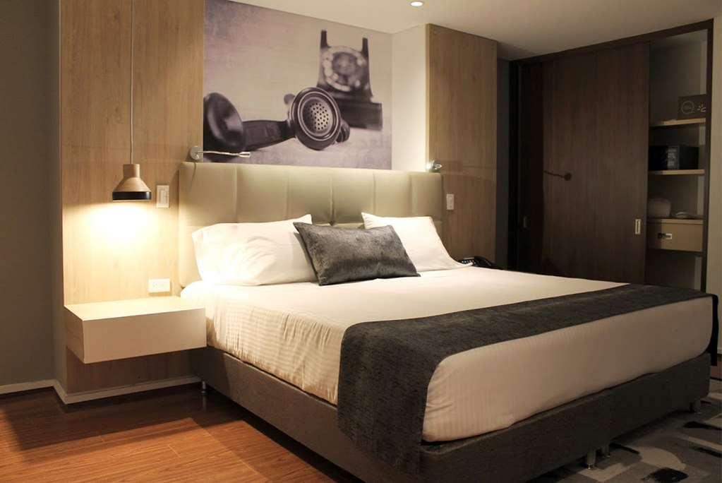 Quo Quality Hotel Manizales Oda fotoğraf A bedroom at the hotel