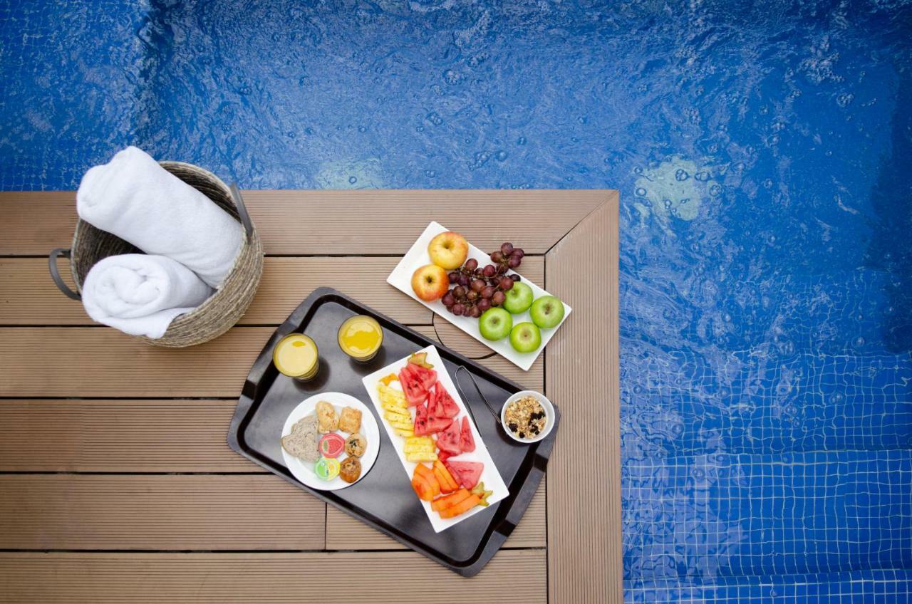 Quo Quality Hotel Manizales Dış mekan fotoğraf A poolside snack